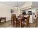 Comfortable dining area adjacent to the living room, featuring hardwood floors and neutral decor at 3151 Britannia Blvd # C, Kissimmee, FL 34747