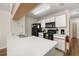 Clean kitchen features white cabinets, modern appliances, and a spacious countertop for meal preparation at 3151 Britannia Blvd # C, Kissimmee, FL 34747