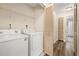 Convenient laundry room with washer, dryer, shelving and storage space at 3151 Britannia Blvd # C, Kissimmee, FL 34747