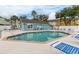 Community pool with ample seating and clear blue water, perfect for relaxing on a sunny day at 3151 Britannia Blvd # C, Kissimmee, FL 34747