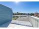 Scenic view from a white-railed balcony showcasing the community's landscape at 8716 Rain Forest Pl # D, Kissimmee, FL 34747