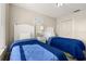 Bright bedroom features twin beds with modern furniture and closet at 8716 Rain Forest Pl # D, Kissimmee, FL 34747