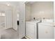 Convenient laundry area with washer, dryer, and storage space at 8716 Rain Forest Pl # D, Kissimmee, FL 34747