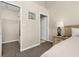 Main bedroom leading to a closet with wire shelving at 8716 Rain Forest Pl # D, Kissimmee, FL 34747