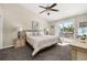 Bright bedroom featuring a ceiling fan, a sliding glass door that opens to a balcony and comfortable furnishings at 8716 Rain Forest Pl # D, Kissimmee, FL 34747