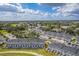 Aerial view of townhouses with community amenities and lush green areas at 2023 Claudia Ln, Kissimmee, FL 34741