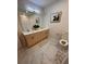 Spa-like bathroom with double vanity and marble-look tile flooring at 2023 Claudia Ln, Kissimmee, FL 34741