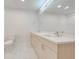 Modern bathroom with double vanity, quartz countertop, and large mirror at 2023 Claudia Ln, Kissimmee, FL 34741