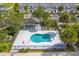 Arial view of community pool and patio area with palm trees at 2023 Claudia Ln, Kissimmee, FL 34741