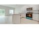 Modern kitchen with island, white cabinets, and granite countertops at 2023 Claudia Ln, Kissimmee, FL 34741