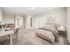 Charming bedroom featuring neutral colors, a cozy bed, and a stylish desk area at 2949 Nottel Dr, St Cloud, FL 34772
