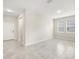 Bright living room featuring neutral paint, tile floors, an entrance door, and natural light at 2949 Nottel Dr, St Cloud, FL 34772