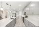 Modern kitchen with gray cabinets, stainless steel appliances, and a spacious center island at 2949 Nottel Dr, St Cloud, FL 34772