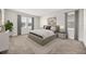 Serene main bedroom with neutral tones, carpet, and large windows for ample natural light at 2949 Nottel Dr, St Cloud, FL 34772