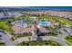 Aerial view of community pool and clubhouse at 8932 Cabot Cliffs Dr, Davenport, FL 33896