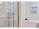 Bathroom with soaking tub and walk-in shower at 8932 Cabot Cliffs Dr, Davenport, FL 33896