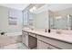Elegant bathroom with double vanity, soaking tub, and walk-in shower at 8932 Cabot Cliffs Dr, Davenport, FL 33896