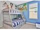 bedroom with bunk beds and Disney themed wall art at 8932 Cabot Cliffs Dr, Davenport, FL 33896