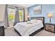 Bedroom with queen-size bed and gray color scheme at 8932 Cabot Cliffs Dr, Davenport, FL 33896