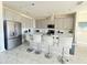 Modern kitchen with island and stainless steel appliances at 8932 Cabot Cliffs Dr, Davenport, FL 33896