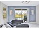 Living area with sectional sofa and view of the pool at 8932 Cabot Cliffs Dr, Davenport, FL 33896