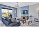 Bright living room with comfy seating and large TV at 8932 Cabot Cliffs Dr, Davenport, FL 33896