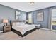 Main bedroom with king-size bed and two nightstands at 8932 Cabot Cliffs Dr, Davenport, FL 33896