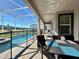 Relaxing screened-in pool area with patio furniture at 8932 Cabot Cliffs Dr, Davenport, FL 33896