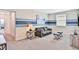 Recreation room with sofa and two ottomans at 8932 Cabot Cliffs Dr, Davenport, FL 33896