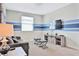 Recreation room with sofa, ottomans, and large TV at 8932 Cabot Cliffs Dr, Davenport, FL 33896
