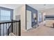Upstairs hallway with access to bedrooms and storage at 8932 Cabot Cliffs Dr, Davenport, FL 33896