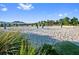 Sand volleyball court with netting, providing a space for residents to engage in outdoor sports and activities at 8932 Cabot Cliffs Dr, Davenport, FL 33896