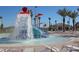 Community waterpark with slides and a splash pad at 8932 Cabot Cliffs Dr, Davenport, FL 33896