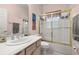 Bathroom with shower/tub combo and updated vanity at 1287 Glendora Rd, Kissimmee, FL 34759