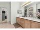 Double vanity bathroom with walk-in closet at 1287 Glendora Rd, Kissimmee, FL 34759