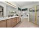 Bathroom boasts double vanity, soaking tub, and shower at 1287 Glendora Rd, Kissimmee, FL 34759
