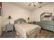 Bedroom with striped bedding and a mirrored dresser at 1287 Glendora Rd, Kissimmee, FL 34759