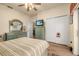 Bedroom with striped bedding and double door closet at 1287 Glendora Rd, Kissimmee, FL 34759