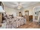 King-size bed in spacious bedroom with wood floors at 1287 Glendora Rd, Kissimmee, FL 34759