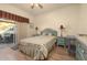 Bedroom with striped bedding and access to a patio at 1287 Glendora Rd, Kissimmee, FL 34759