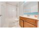Clean, bright bathroom featuring a combination tub and shower, and a vanity with ample storage at 1819 Coriander Dr # 1819, Kissimmee, FL 34759