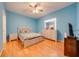 Bright bedroom with a modern bed, dresser, and ample natural light from the large window at 1819 Coriander Dr # 1819, Kissimmee, FL 34759