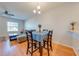 Bright dining area features wood floors, chandelier lighting, and a table set for four at 1819 Coriander Dr # 1819, Kissimmee, FL 34759