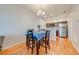 Charming dining area with wood floors, a modern chandelier, and an adjacent kitchen at 1819 Coriander Dr # 1819, Kissimmee, FL 34759