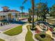 Community entrance with Tuscan-inspired architecture and well-manicured landscaping at 1819 Coriander Dr # 1819, Kissimmee, FL 34759
