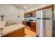 Well-equipped kitchen with stainless steel appliances, wooden cabinets, and modern countertops at 1819 Coriander Dr # 1819, Kissimmee, FL 34759
