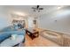Bright living area with hardwood floors and an open layout to the kitchen and dining spaces at 1819 Coriander Dr # 1819, Kissimmee, FL 34759