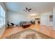Open-concept living space with hardwood floors, dining area, and comfortable seating at 1819 Coriander Dr # 1819, Kissimmee, FL 34759