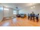Spacious living room with hardwood floors, a comfortable sofa, and a dining area at 1819 Coriander Dr # 1819, Kissimmee, FL 34759