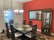 Formal dining room with a decorative hutch, stylish table setting, and unique light fixture at 20526 Quinella St, Orlando, FL 32833